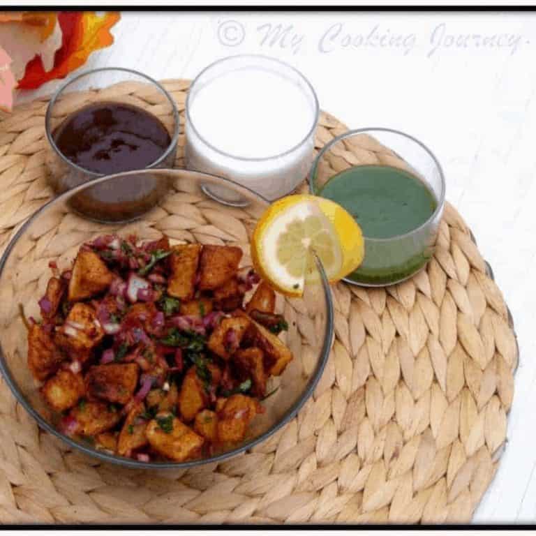 Aloo Chaat with chutney and yogurt on the side - Feature Image