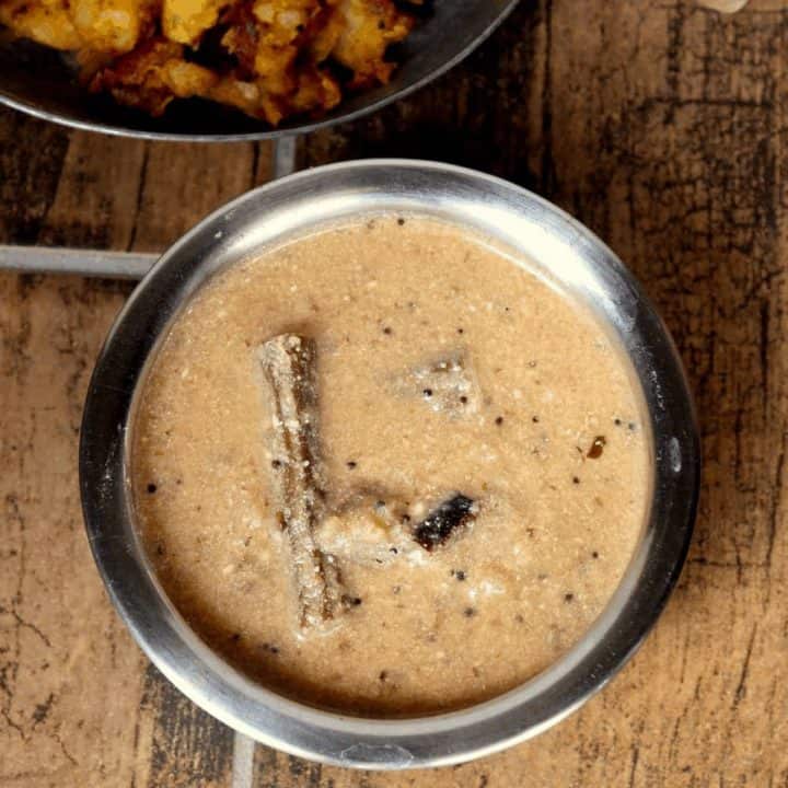 Iru Puli Kuzhambu in stainless bowl - Feature Image