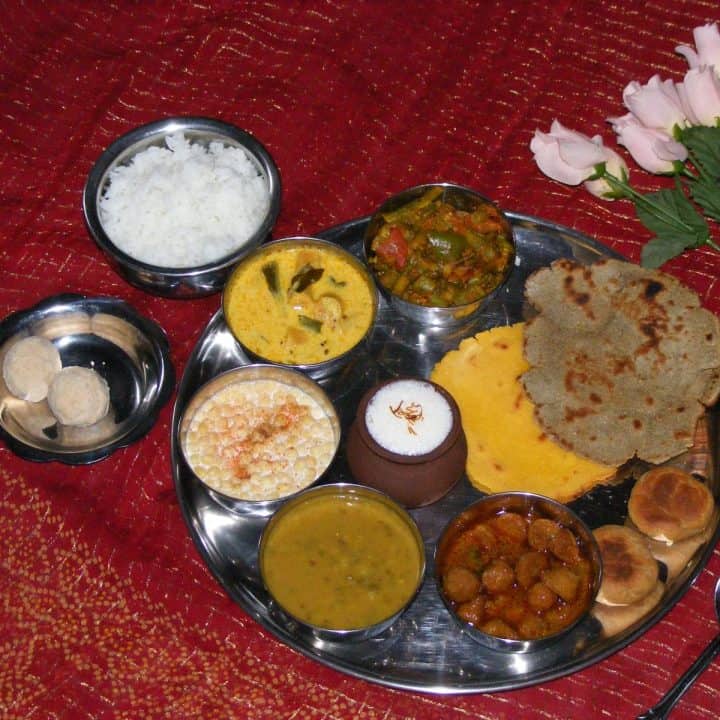 Rajasthani Thali in a stainless steel plate - Feature Image