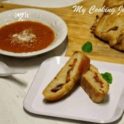 Tomato Mozzarella and Basil Stuffed Baguettes in a white plate - Featured Image
